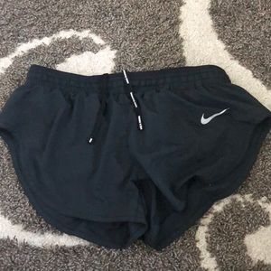Black Nike running shorts